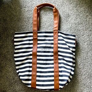 Navy and white stripped tote with tan faux leather straps